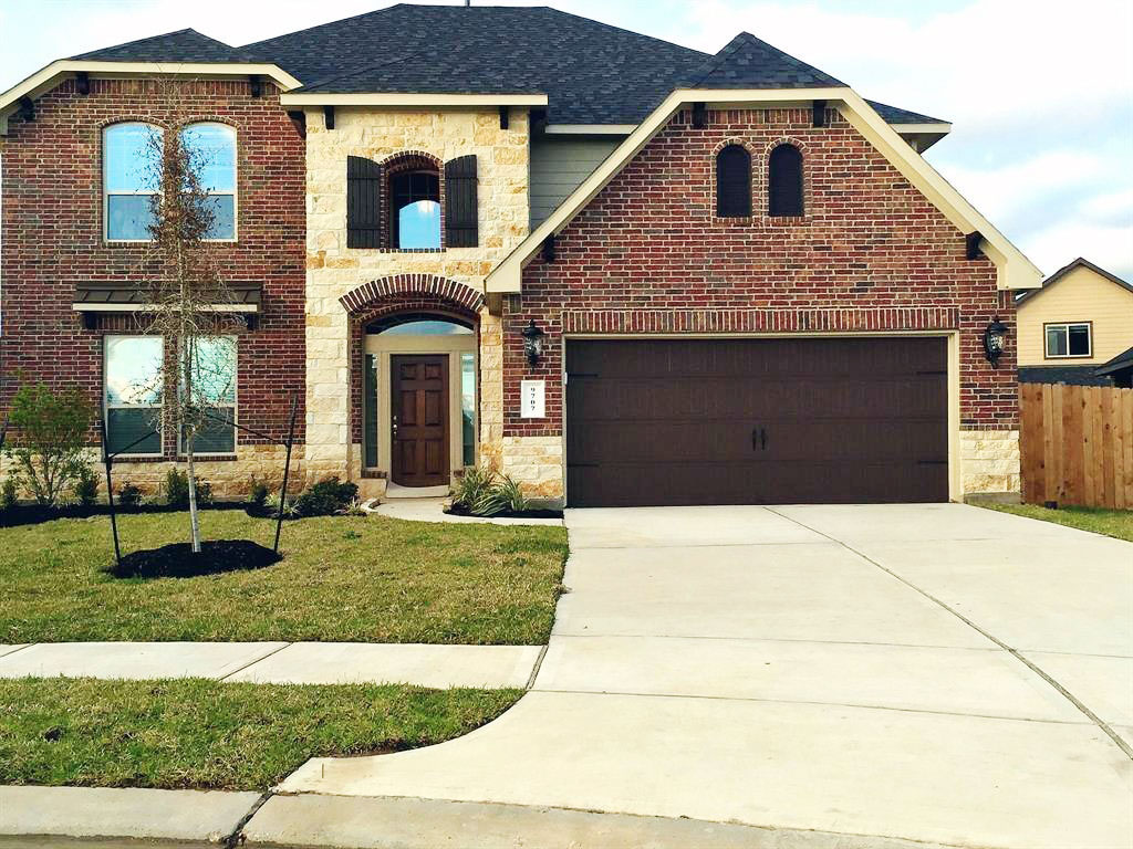 Real estate agent showing a family a house